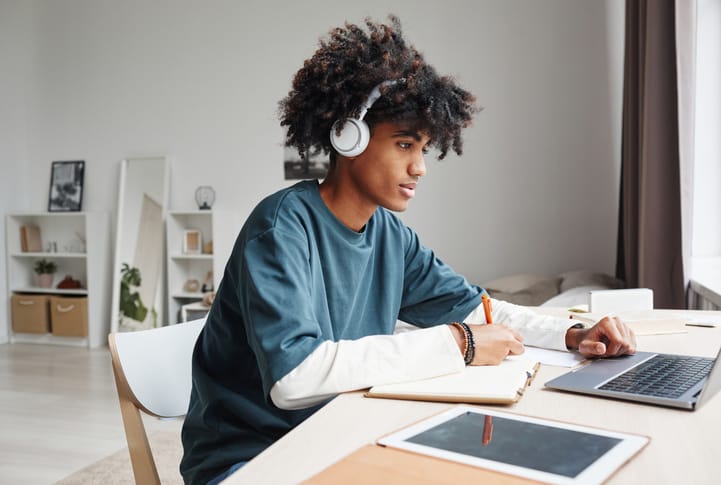 Teenager Doing Homework Side View