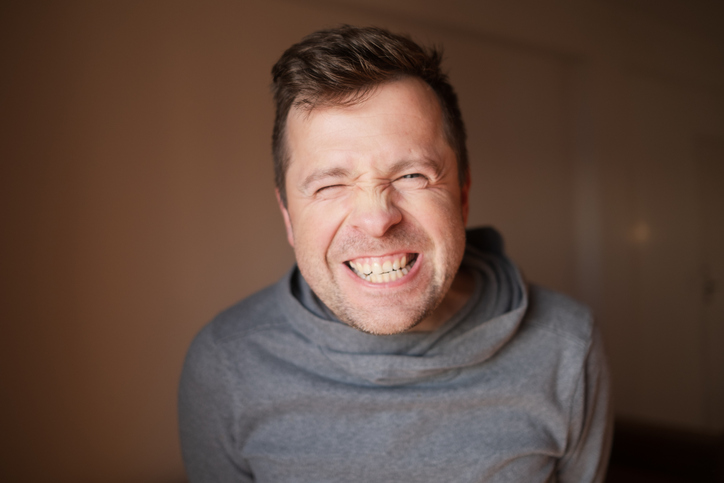 Middle Aged European Man with a Wide Fake Smile, Emotional Portrait. High quality photo